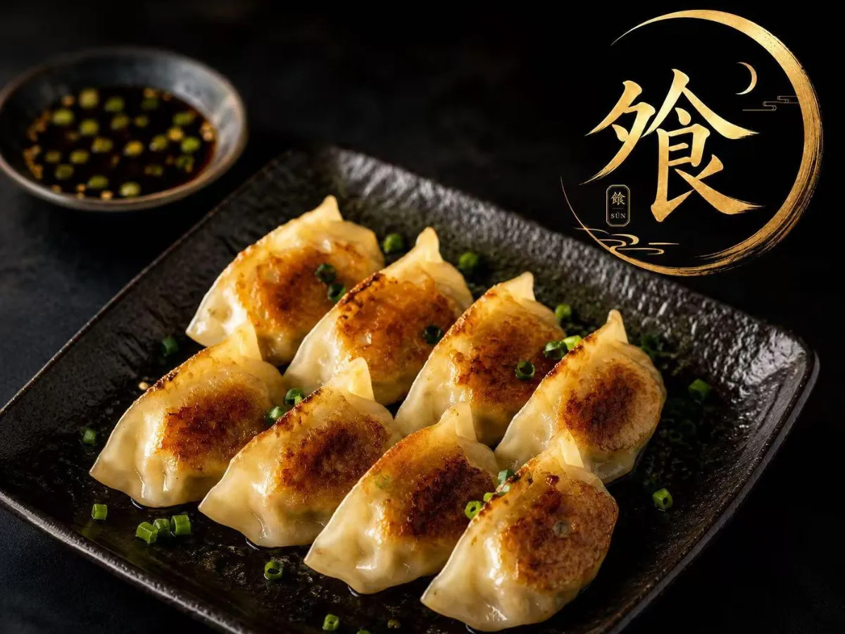 Pan-fried dumplings garnished with chopped green onions at Asian Moon Sushi And Bar, a Japanese Restaurant in Cross River